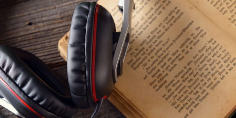 32511116-headphones-on-the-old-book-concept-of-listening-to-audiobooks-640x0