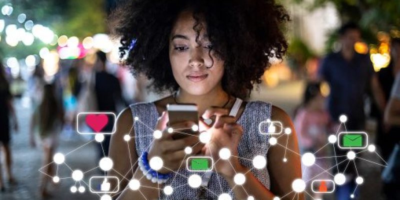 Social media and digital online concept, woman using smartphone and show technology icon.